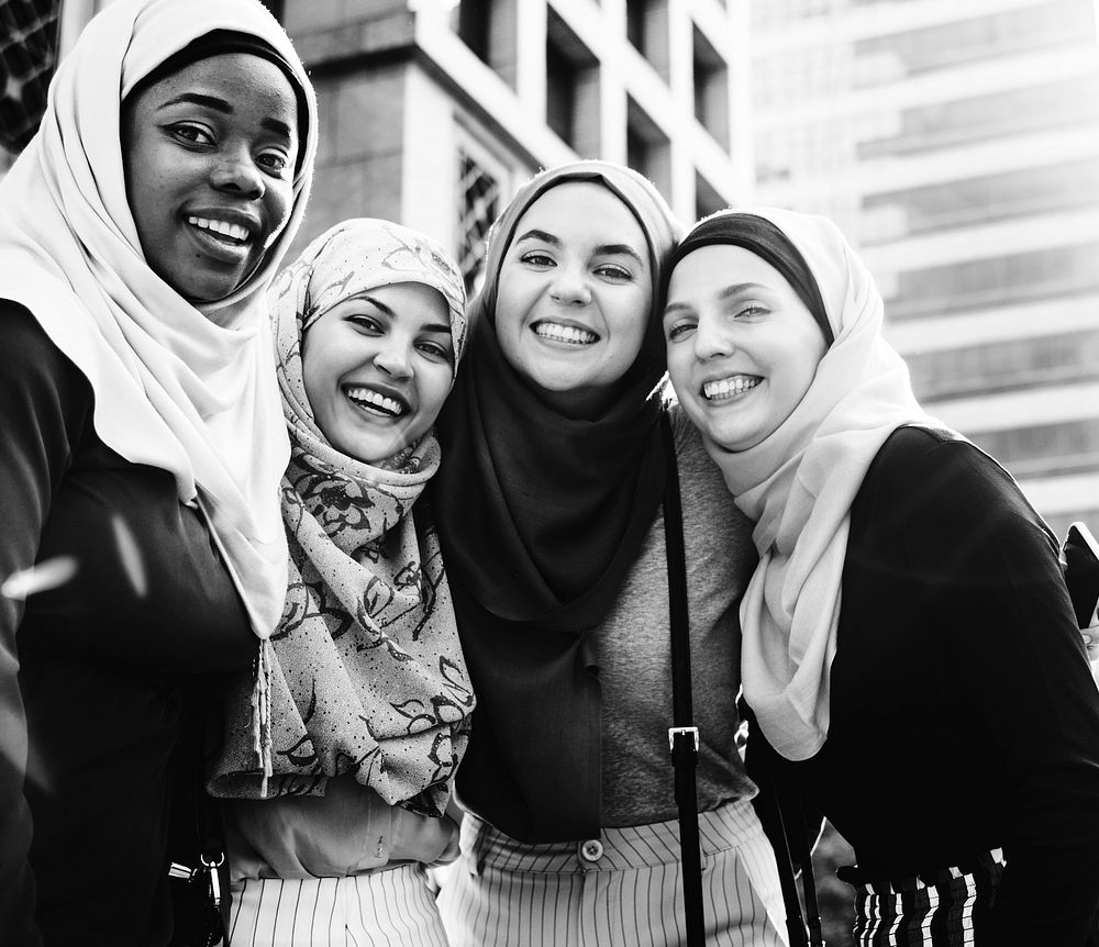 Group of islamic friends embracing and smiling together
