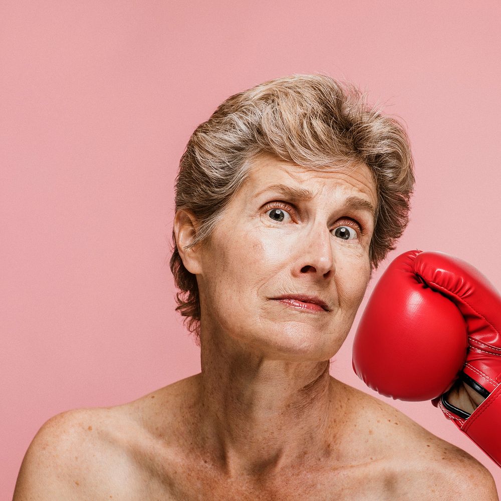 Senior woman getting punched in the face