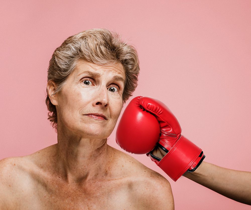 Senior woman getting punched in the face