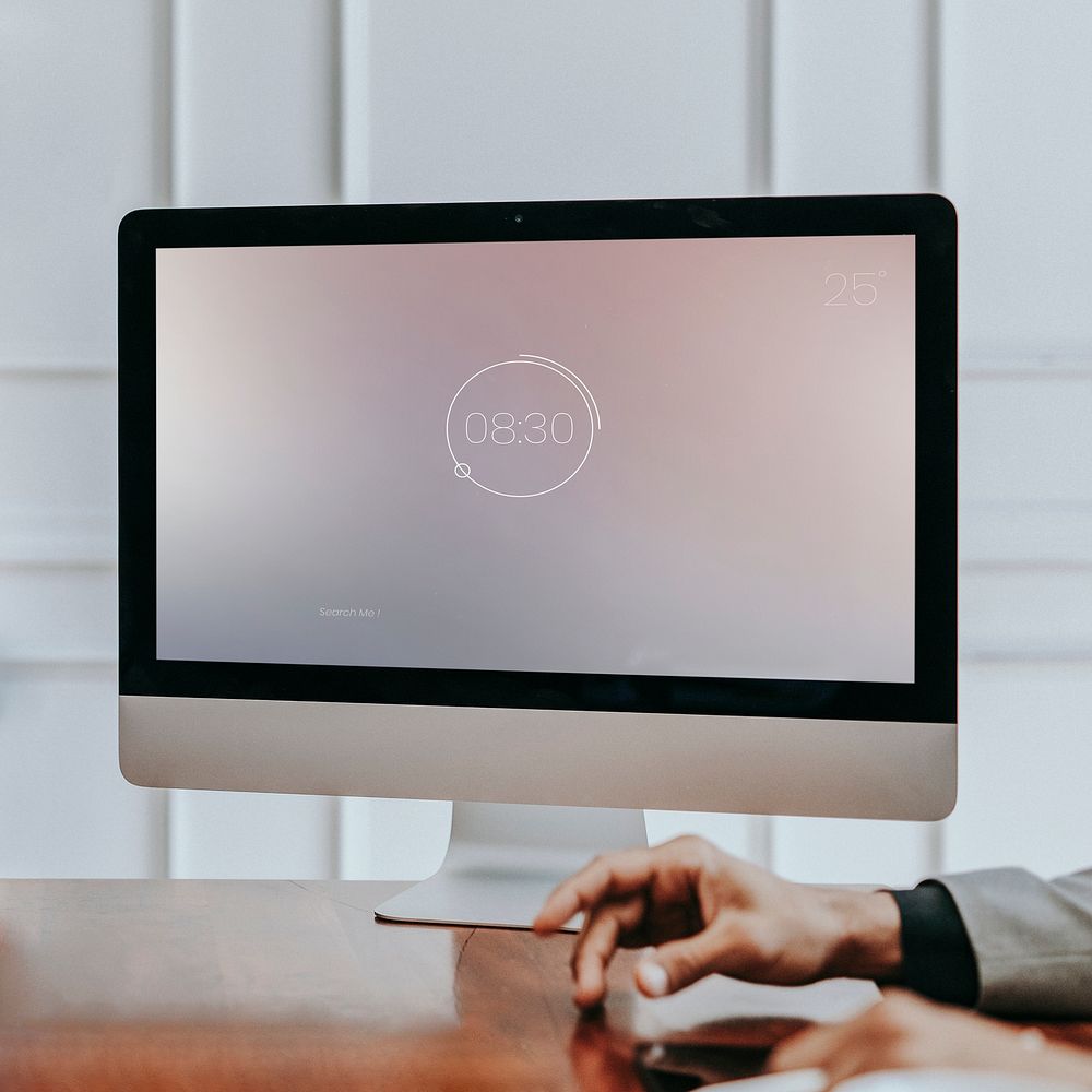 Businessman tapping his finger in front of a computer mockup