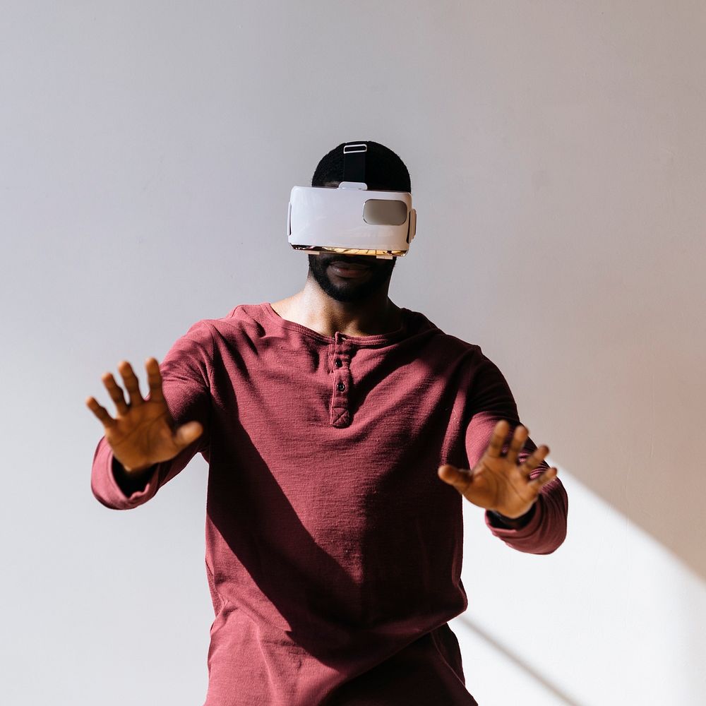 Black man experiencing virtual reality with VR headset social template
