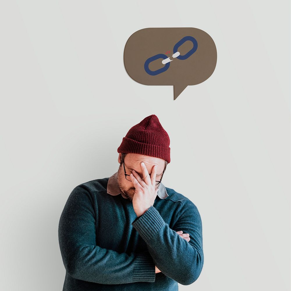 Disappointed man in a red knitted hat