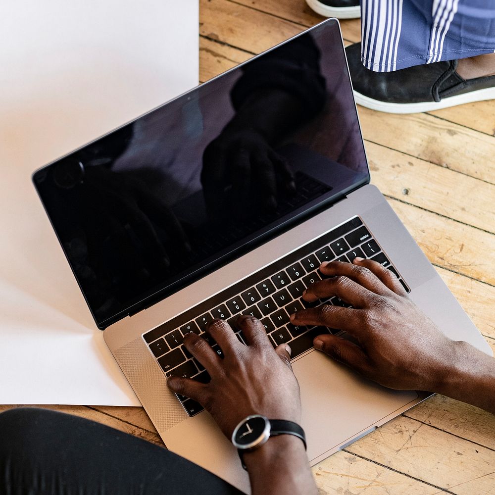 Black man workin from home on a laptop