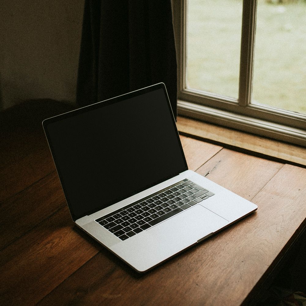 Digital laptop on a wooden table