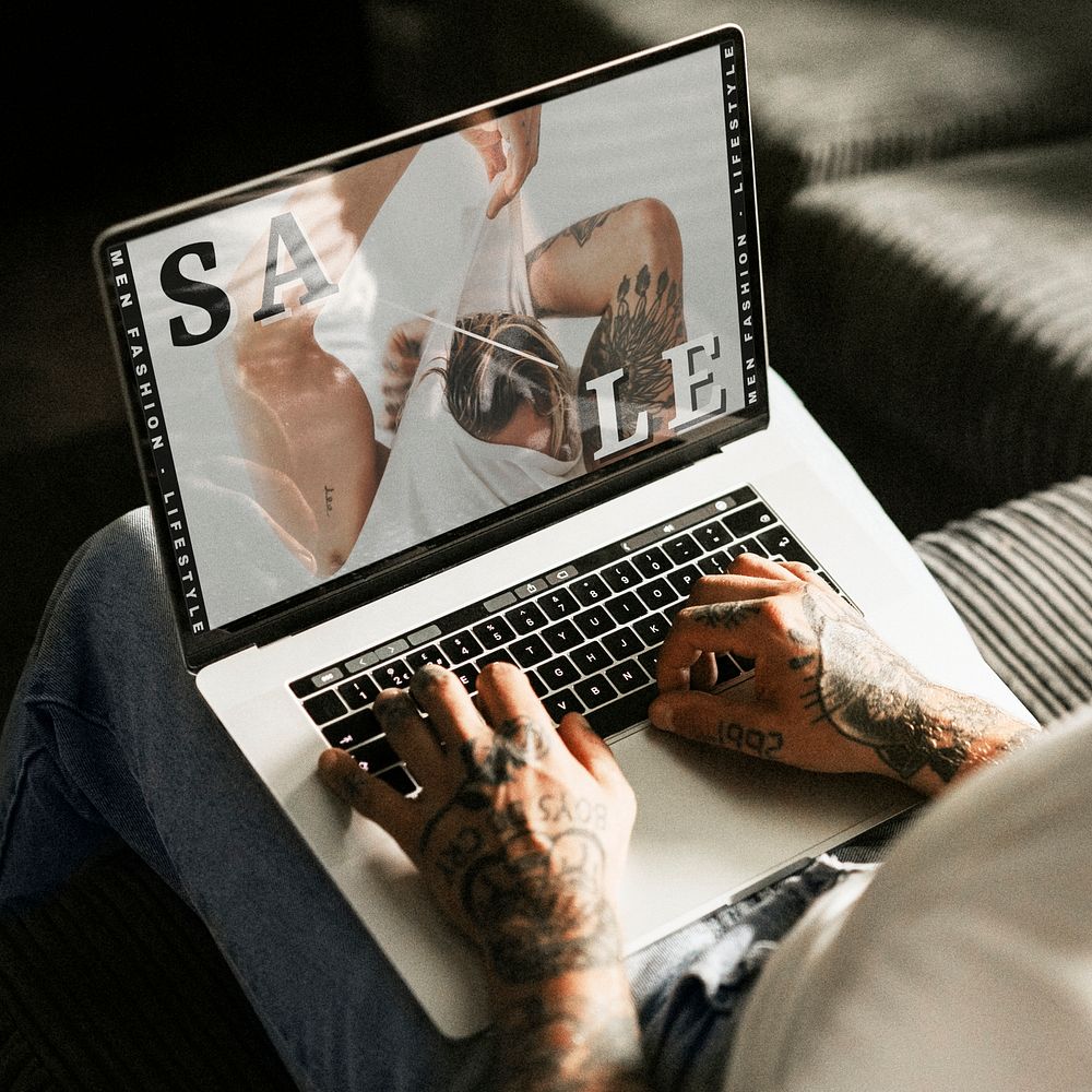Tattooed alternative man shopping online