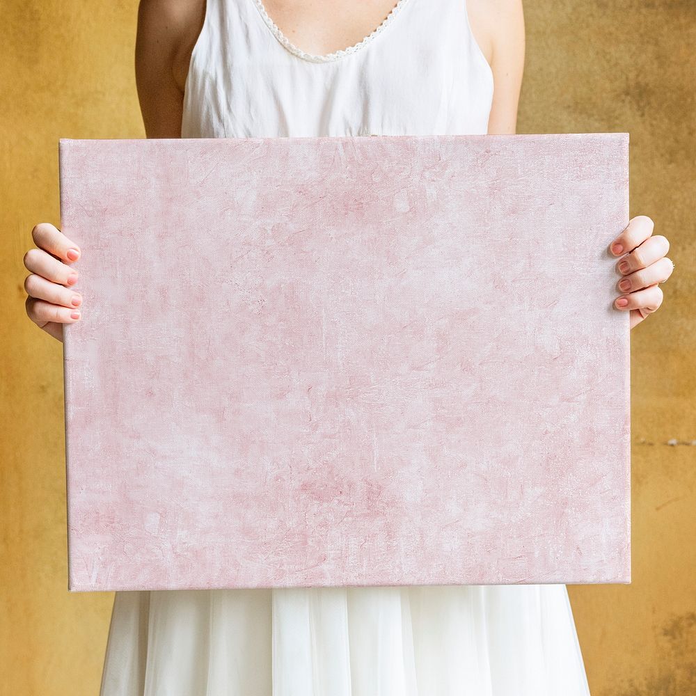 Woman showing a blank canvas