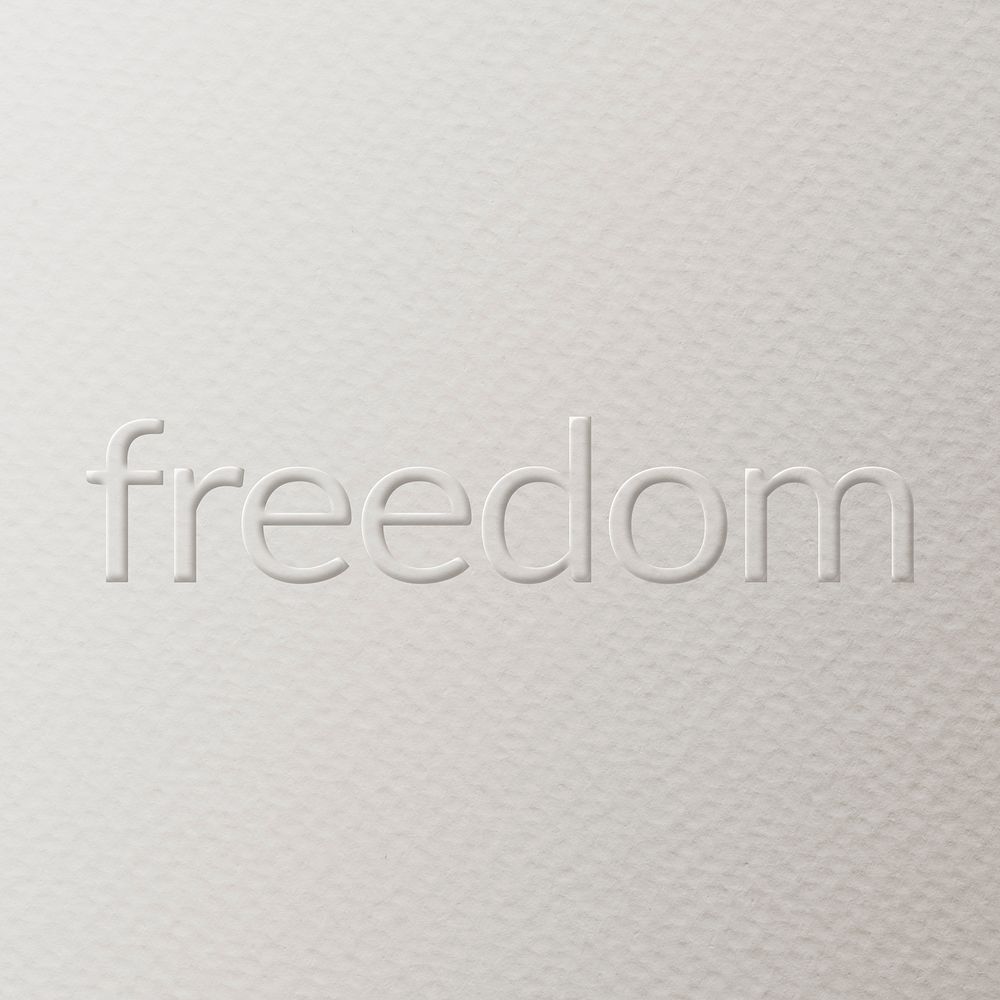 Freedom embossed font white paper background
