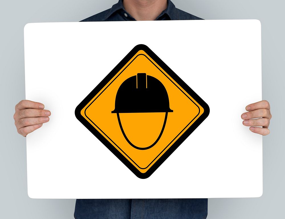 Studio Shoot Holding Banner with Safety Helmet Attention Sign