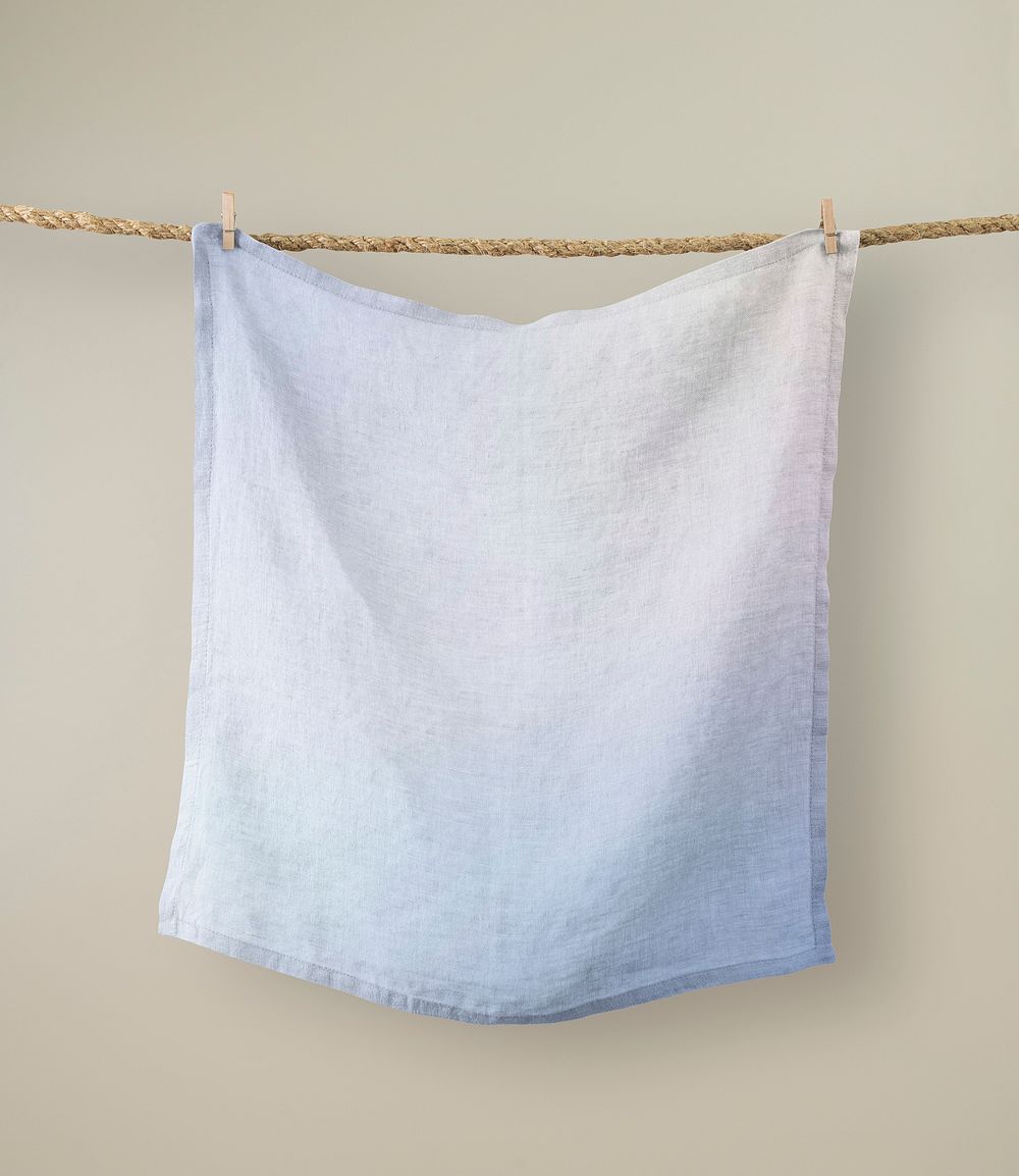 Hanging blue handkerchief, beige wall
