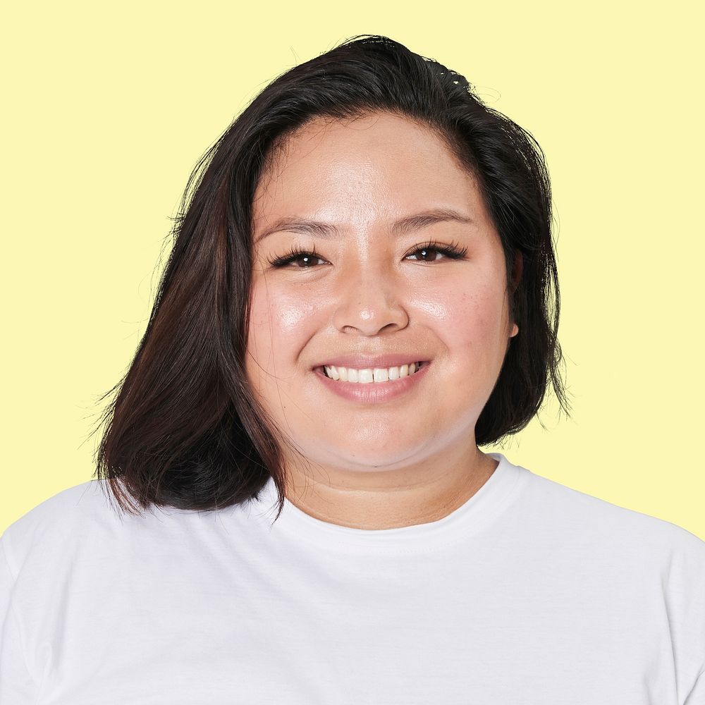 Asian woman smiling face closeup portrait on yellow background