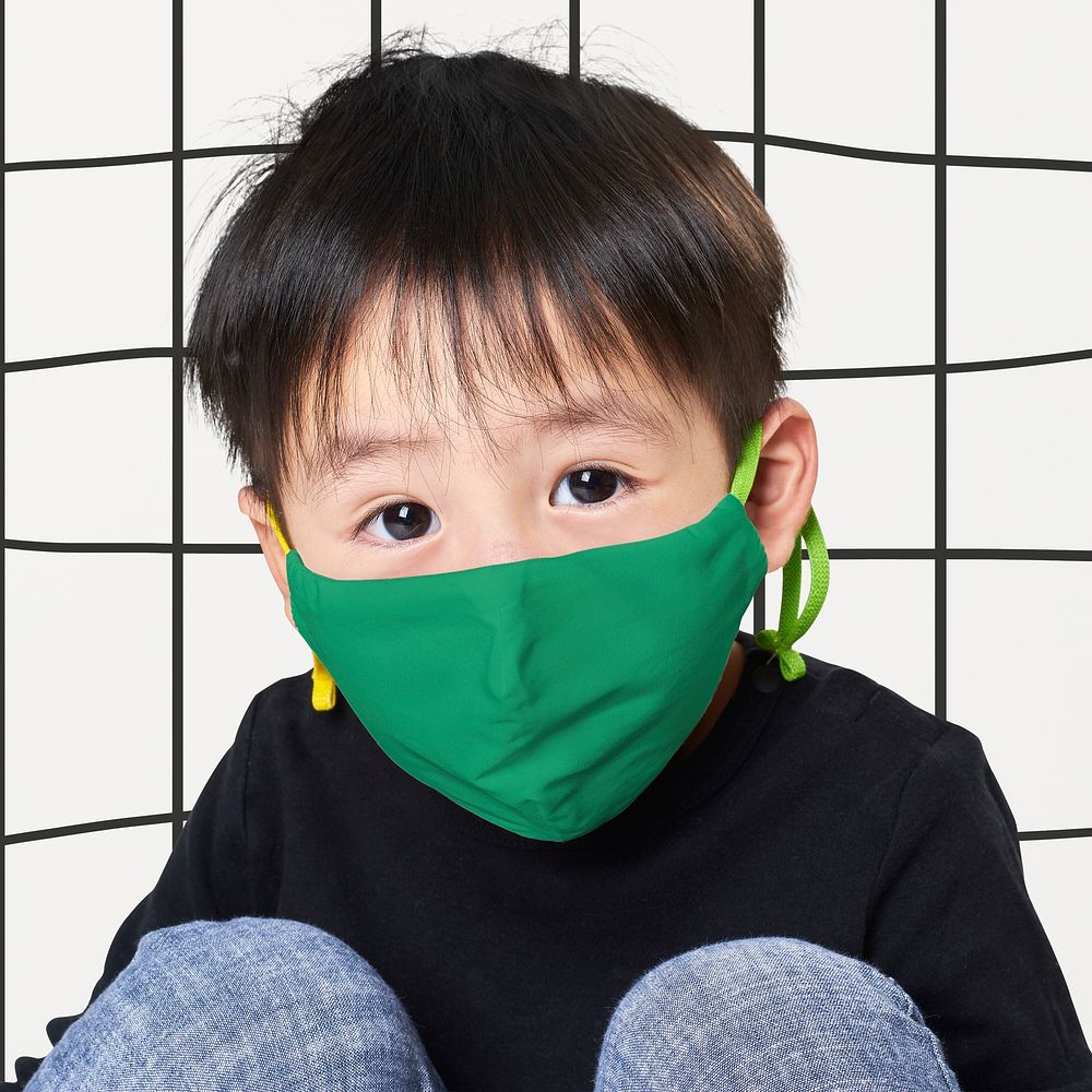 Boy wearing green face mask
