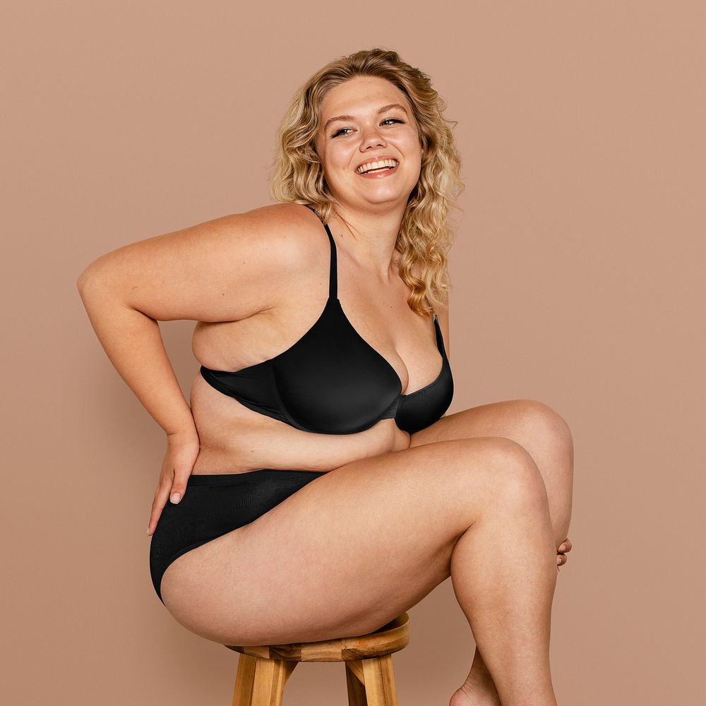Smiling overweight black woman in lingerie · Free Stock Photo