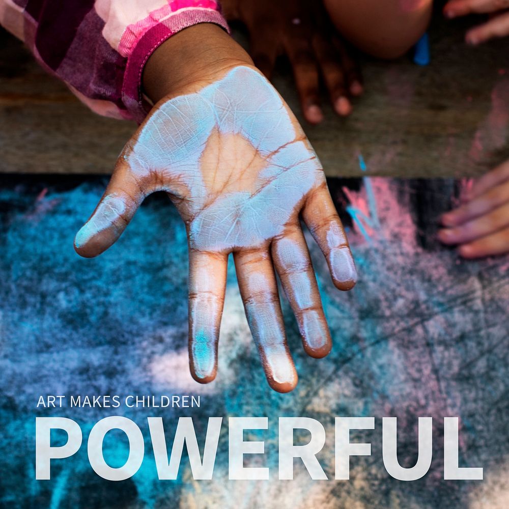 Blue chalk paint on kid hand with art makes children powerful text