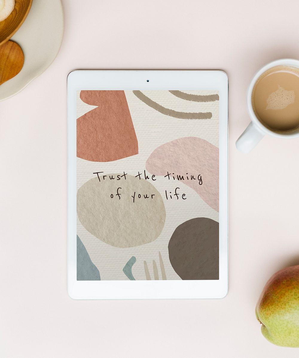 Tablet with inspirational quote, morning drink table, flat lay photo