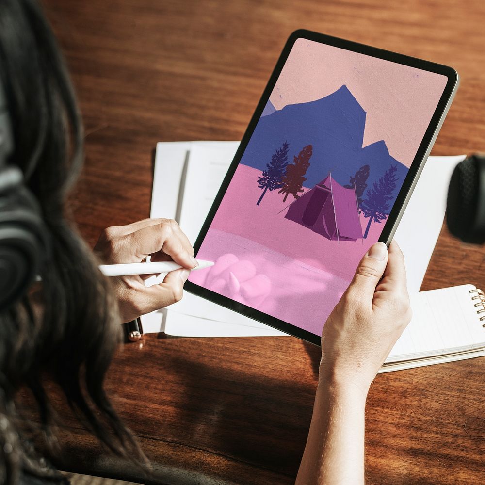 Woman drawing nature camping on tablet