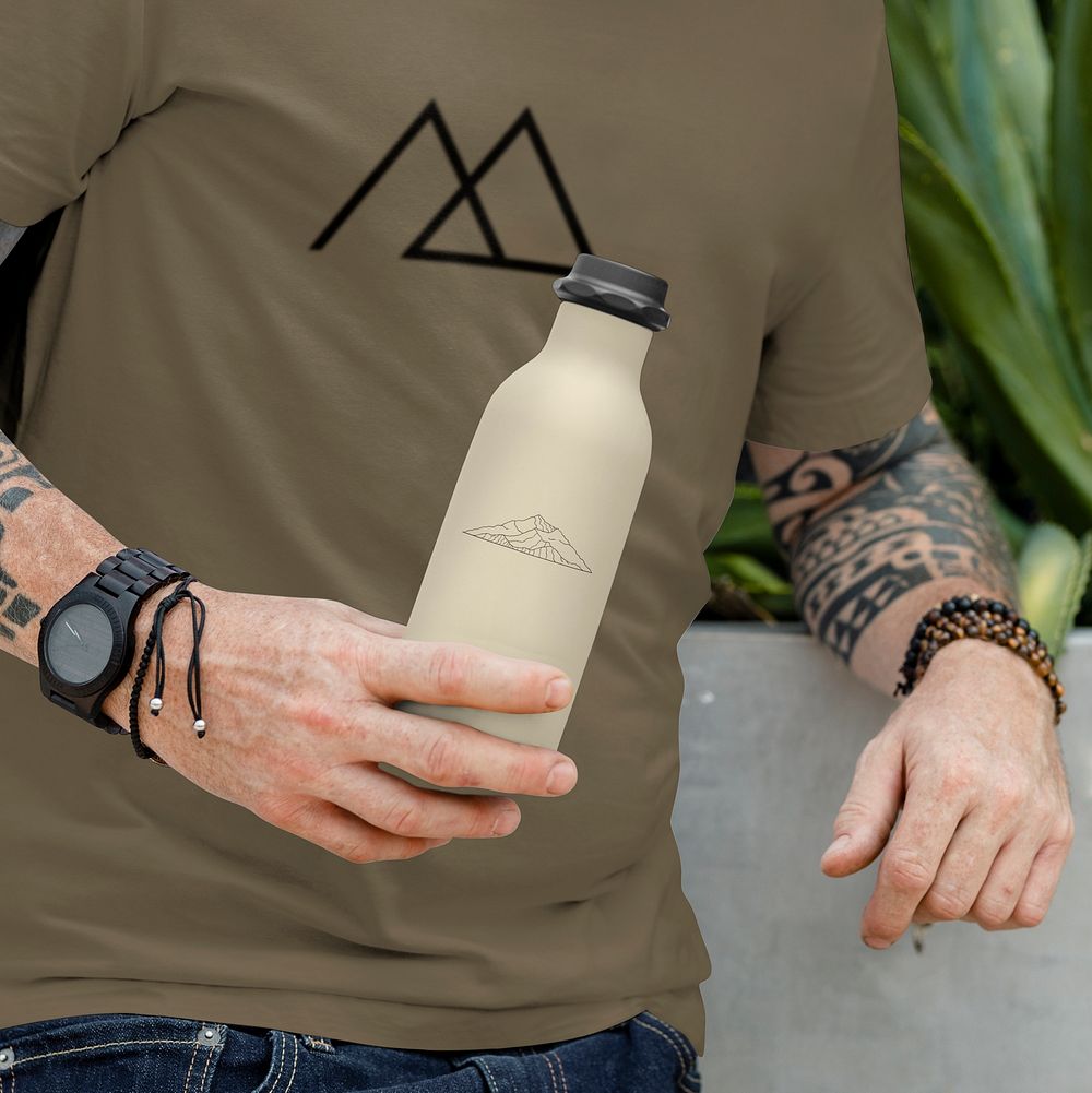 Water bottle mockup in man's hand, editable design  psd