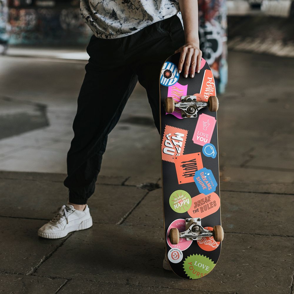 Teenage girl with skateboard, hobby photo
