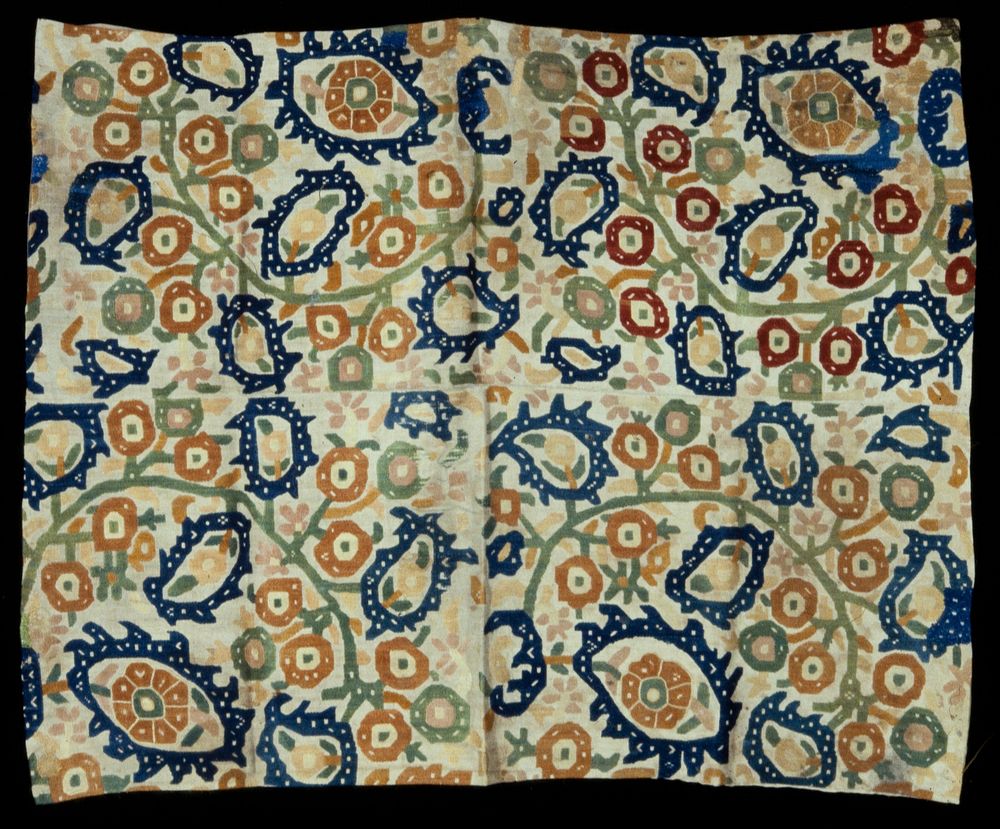 Panel of tan linen with all-over design of geometrical flowers and leaves in tan, blue, green, rose and yellow linen. Chain…