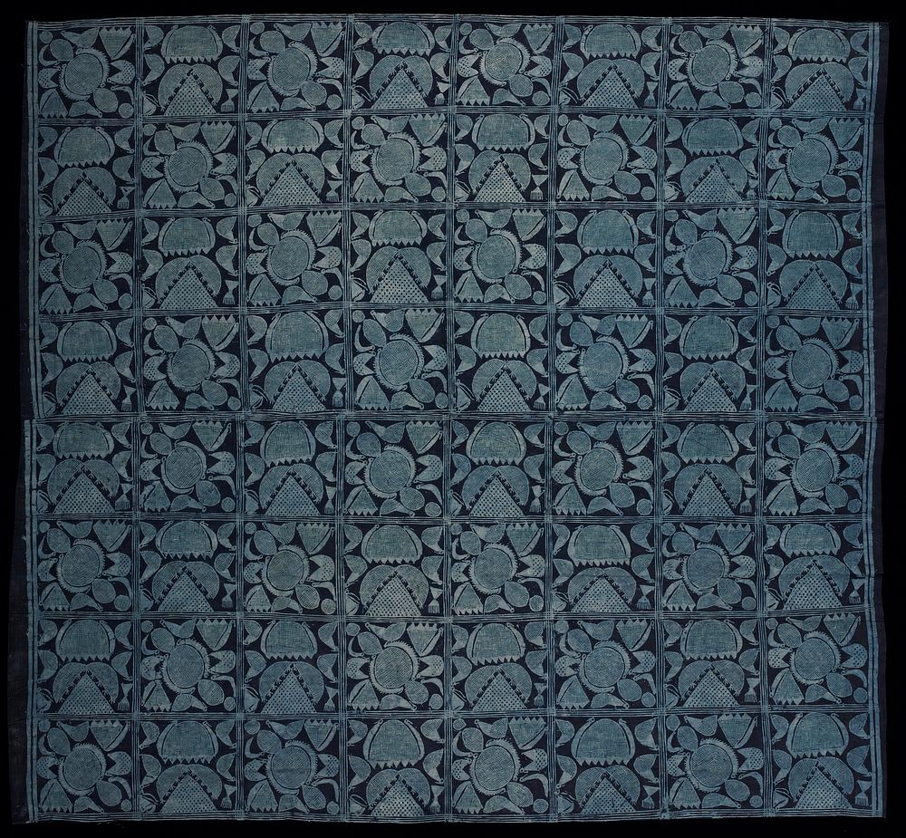 two panels sewn together and hemmed on two sides; indigo with light blue repeating block designs in two motifs with bird and…