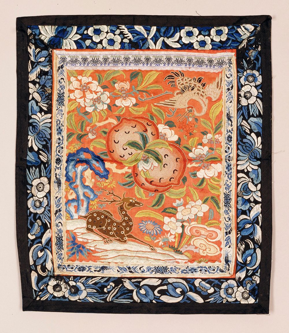 Panel aproicot satin ground elaborately embroidered with animals and flowers and fruit, some of which are worked in Pekin…