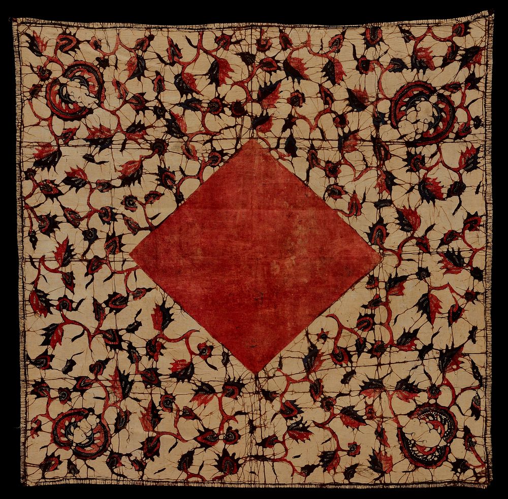 Square, batik, printed. Leaf and vine design in dull red, dark blue and black on tan ground. Square center of dull red..…