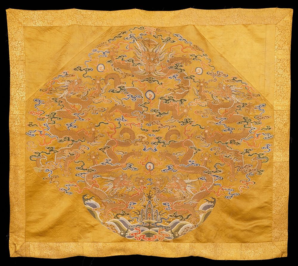 Hanging of light olive-green satin brocade. Five five-clawed dragons in gold one large seated one at upper center; the…