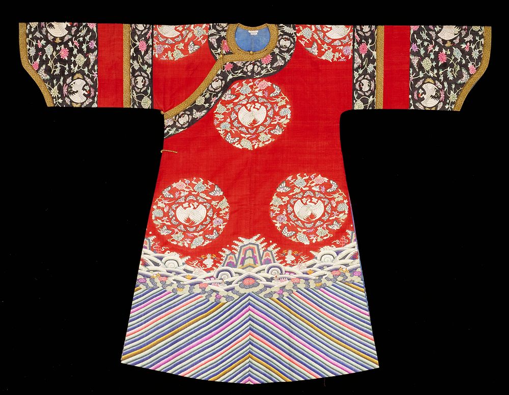 Robe of red silk with eight large k'ossu medallions containing cranes, butterflies, peonies and lotus in shades of light…