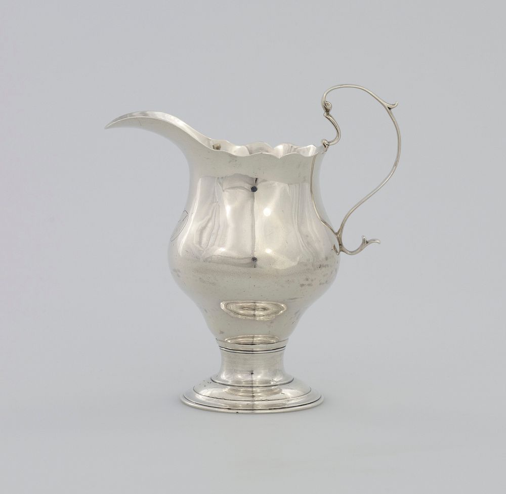 creamer, with scroll cut lip and S-scroll handle, on circular molded foot, monogram on front: [MD]. Original from the…
