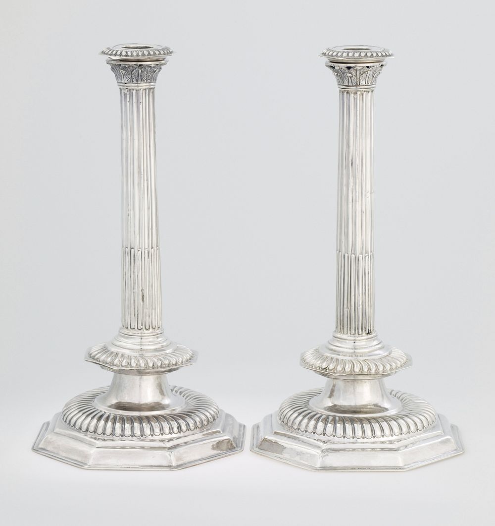 a pair of exceptionally rare, unusually large sized William and Mary candlesticks; plain octagonal bases, with large bold…