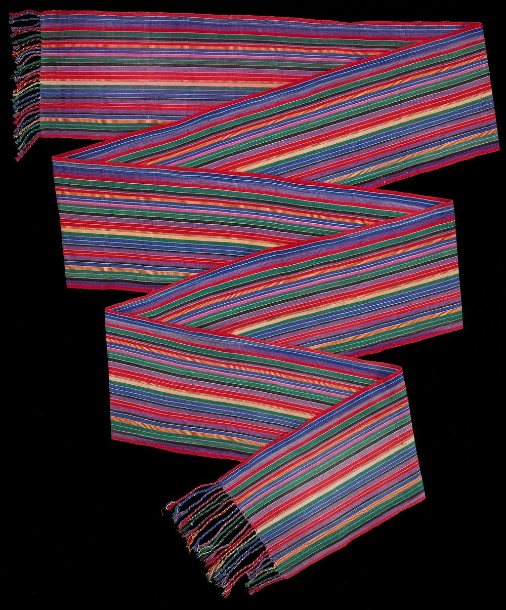 red, purple, brown, yellow, green, orange, pink and white various stripes; twisted fringe at each end. Original from the…