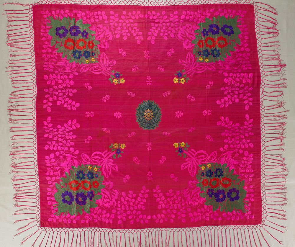 pink fringed silk scarf with floral and foliate embroidery in pink, green, orange, violet and yellow; center medallion and…