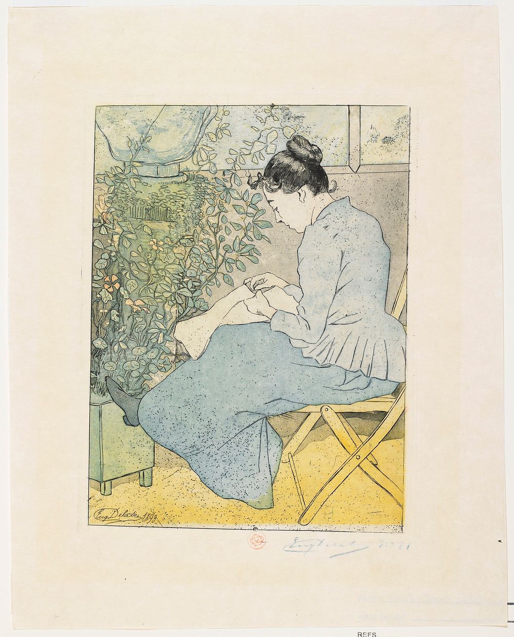 seated woman seen from PL; woman is seated on a yellow folding chair, sewing; dark hair in a bun; woman wears blue jacket…