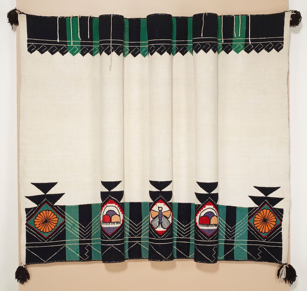 Rectangular textile with green and black bands of embroidered decoration along top edge on non-dyed, woven, plain weave.…