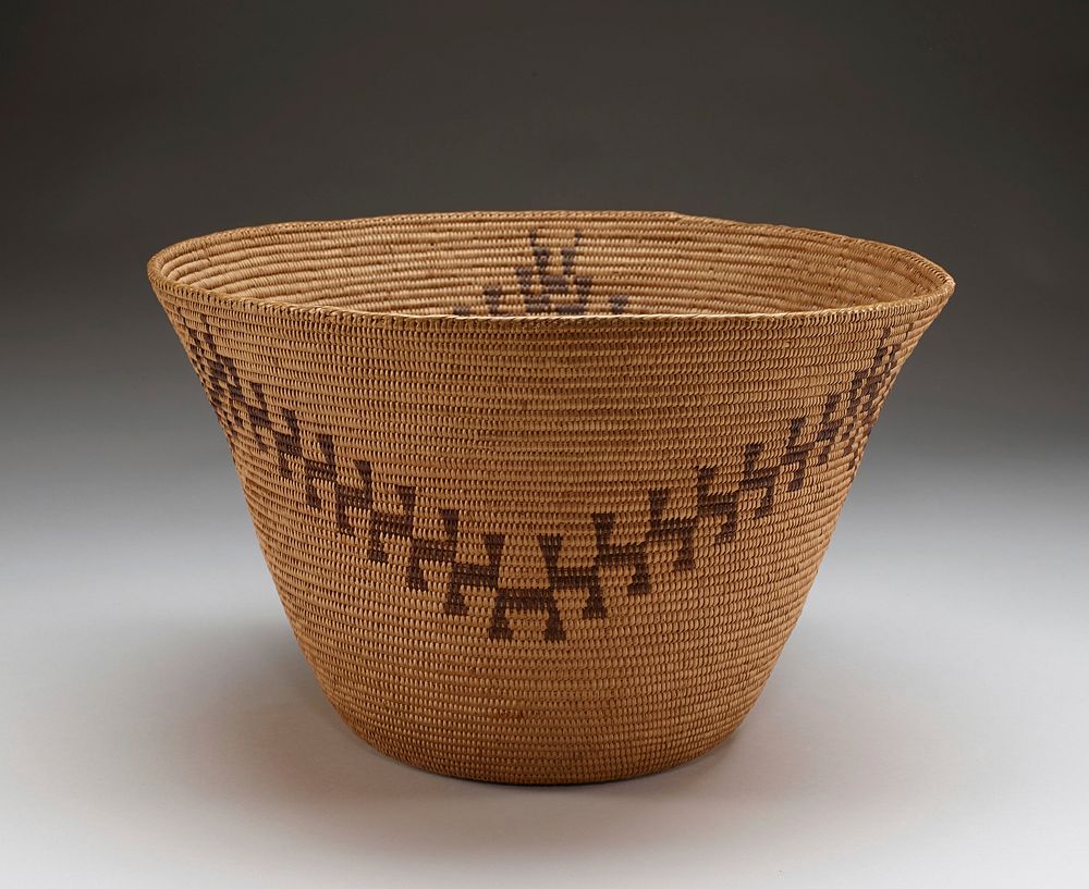 light tan bowl; flat bottom; outward-flaring sides; zigzagging pattern in dark brown. Original from the Minneapolis…
