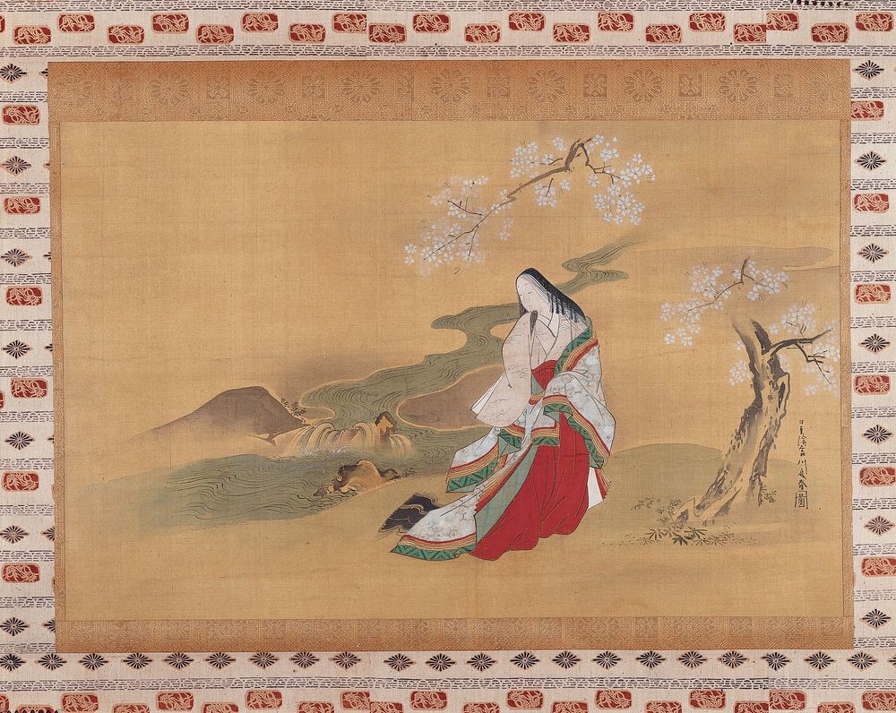 Woman standing under a blossoming tree, in front of a winding stream with small cascade; she is wrapped in a large, white…