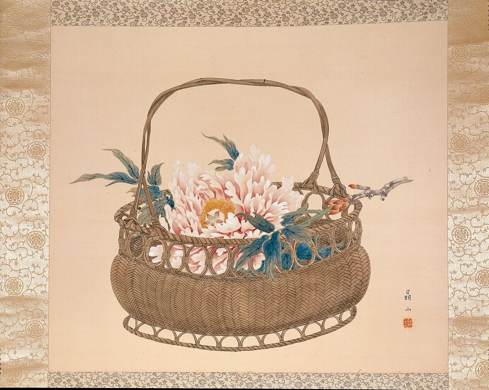 Fully open pink peony in a flower basket; short blossoming branch at R; basket has herringbone weave with looping design…