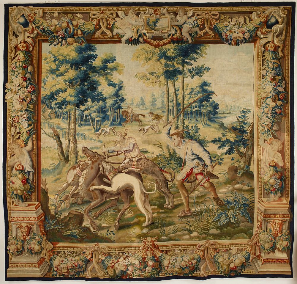 central scene of two hunters with three dogs attacking a stag; other dogs and figures on horseback and running in…