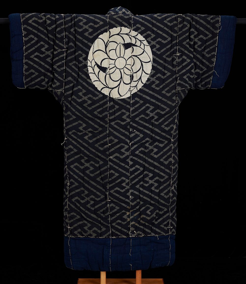 thick, padded kimono; grey and black geometric design on torso and sleeves; grey and black multi-directional diagonal stripe…