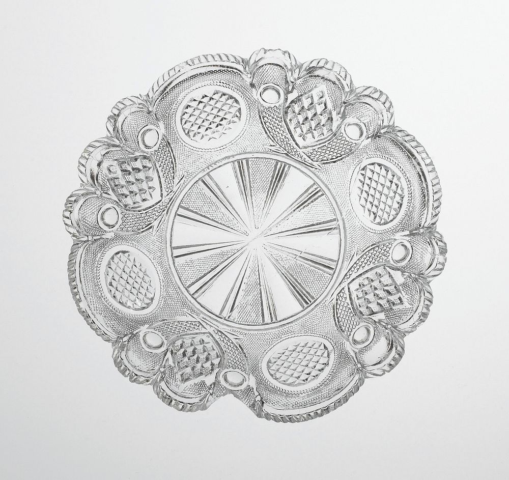 molded glass plate with starburst at center; scalloped edge; four circles alternating with four diamonds on side; overall…