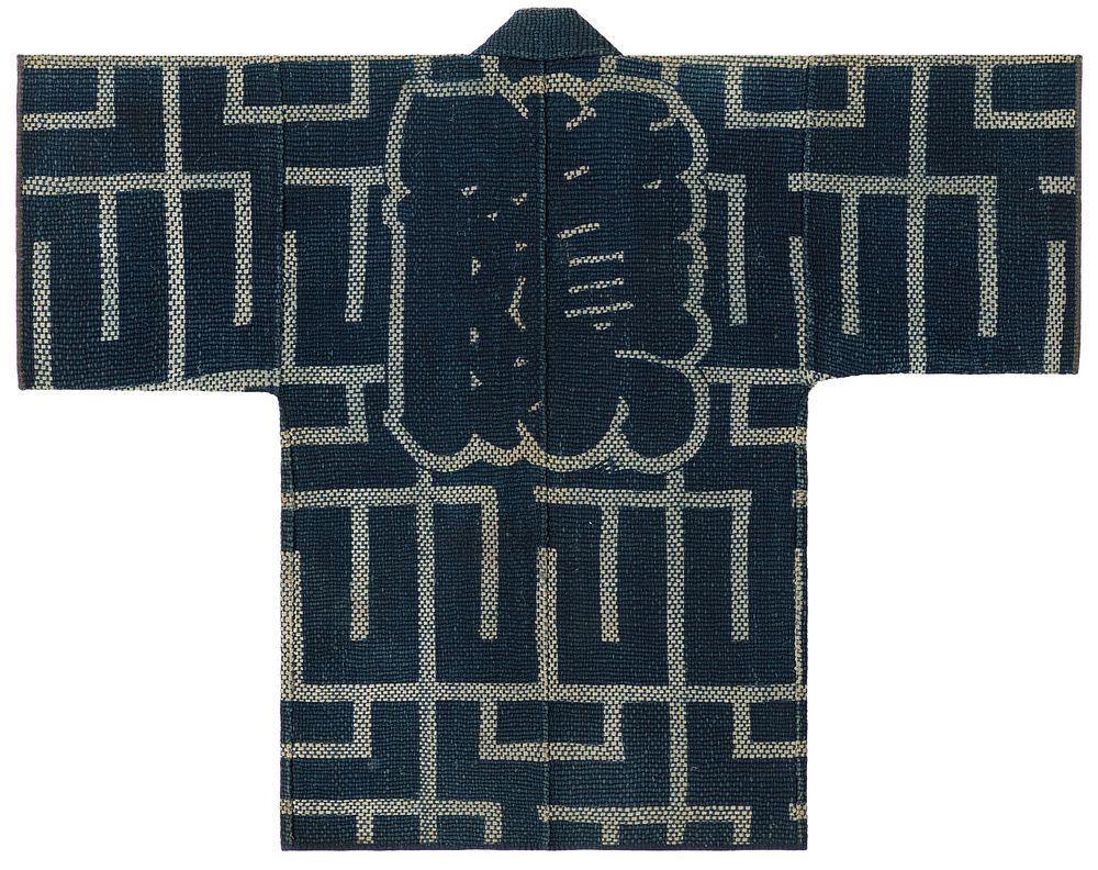 Short, navy blue tightly quilted robe with intersecting, horizontal and vertical off-white line pattern, tan Japanese…