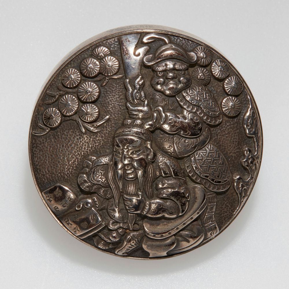 Silver button-like object with loop on back; relief design with two men, with standing man at back holding hair of seated…