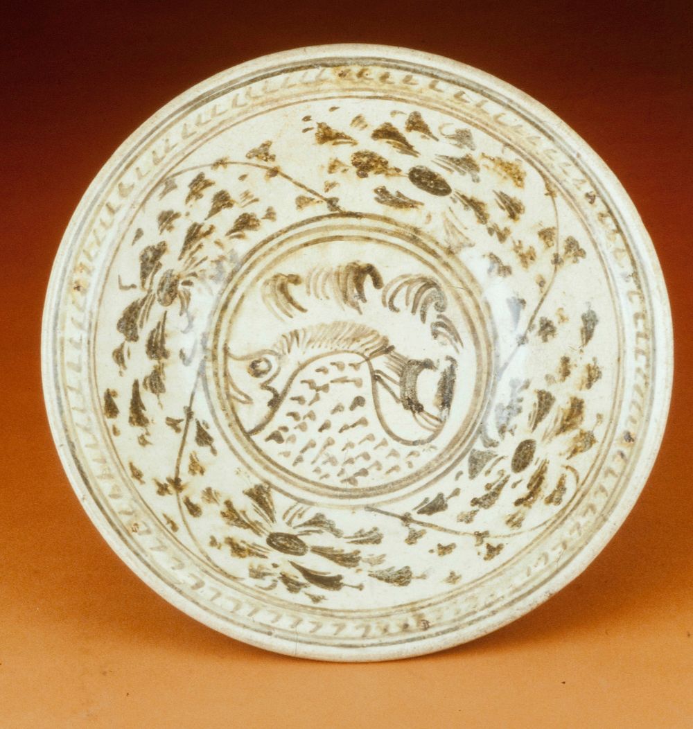 Sukhothai Plate, earthenware with fish and floral decoration, underglaze brown.. Original from the Minneapolis Institute of…