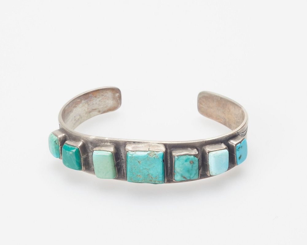 Silver sheet band; set with seven flat square turquoises. J.#293, Cat.#88. Original from the Minneapolis Institute of Art.