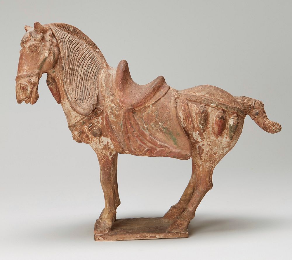 ceramic standing saddled horse with head turned to proper left; traces of black, green and red pigment. Original from the…