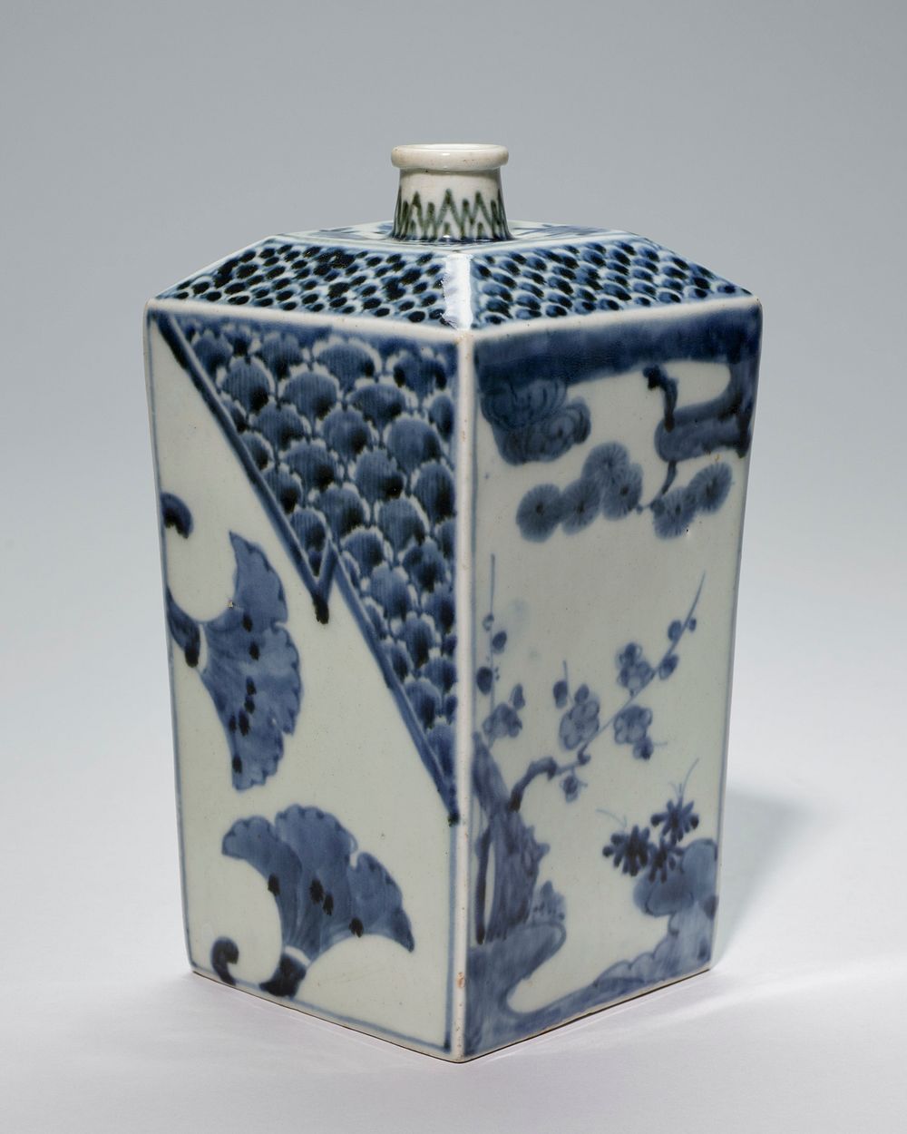 sake bottle rectangular, blue and white Imari, with pine, bamboo and prunus branches; porcelain. Original from the…