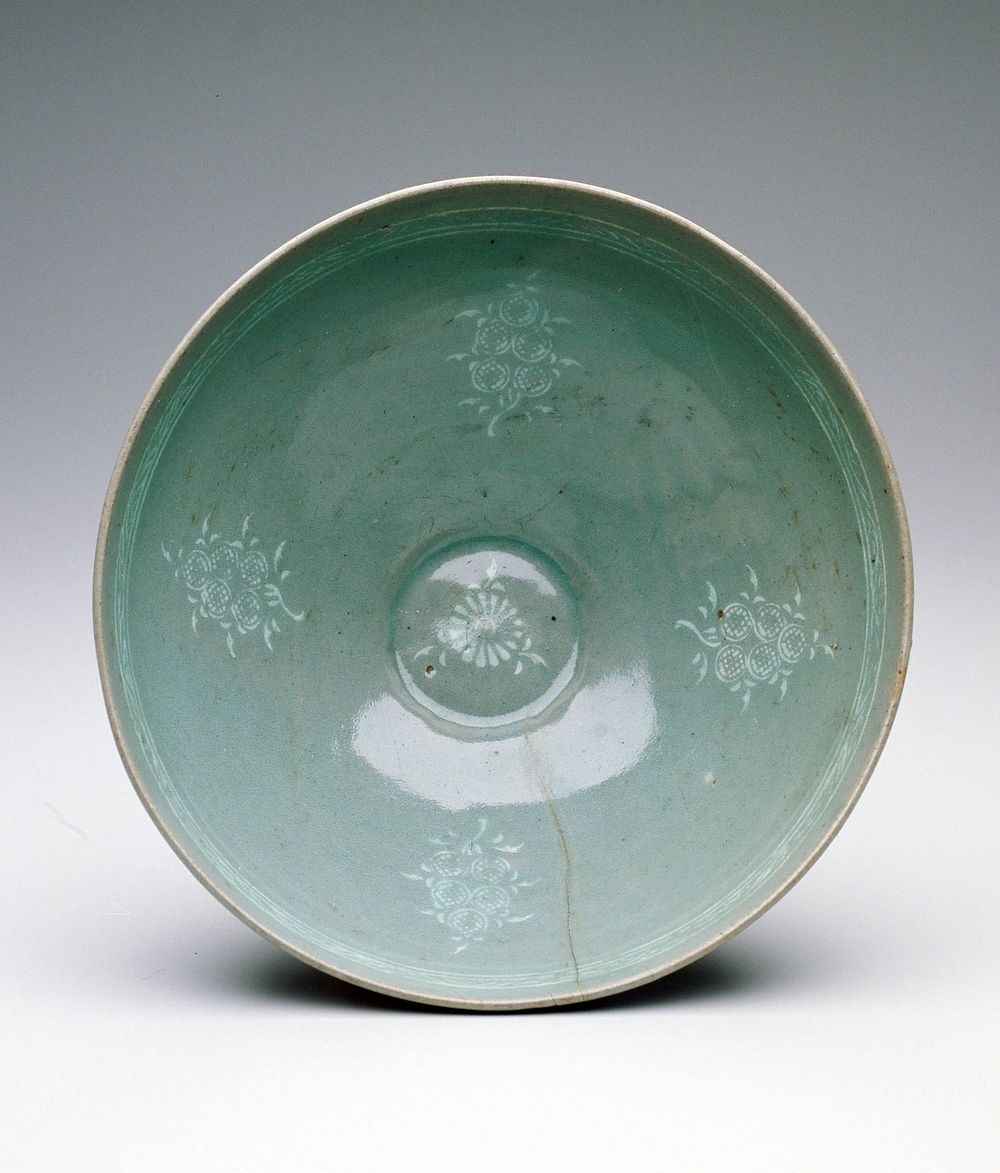 bowl four floral medallions underglazed with white slip; celadon glaze. Original from the Minneapolis Institute of Art.