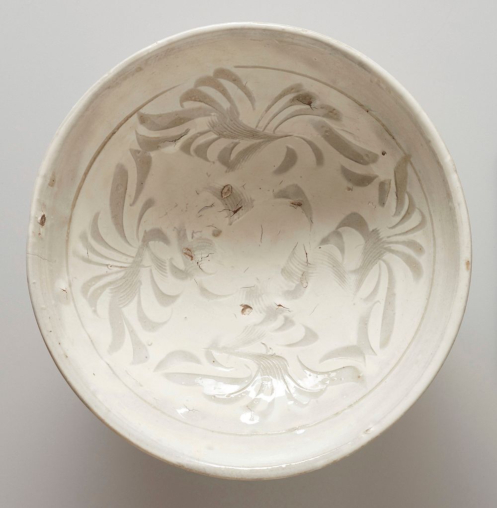 Bowl, Tzu-Chou ware; ring foot; interior incised with floral design under white glaze. Original from the Minneapolis…