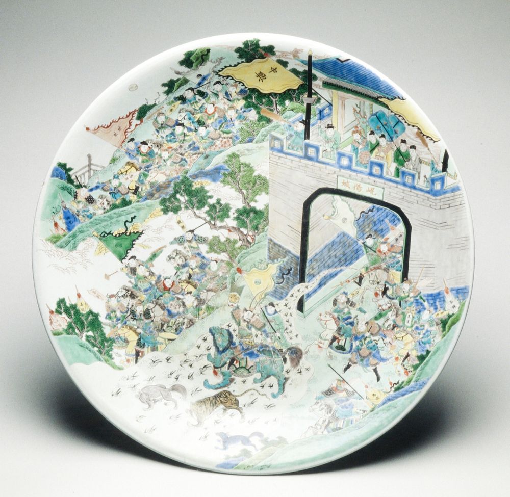 Plate, porcelain, famille verte enamels (turquoise, blue, iron-red, black and gold). Scene of mythical battle. Emperor Liu…