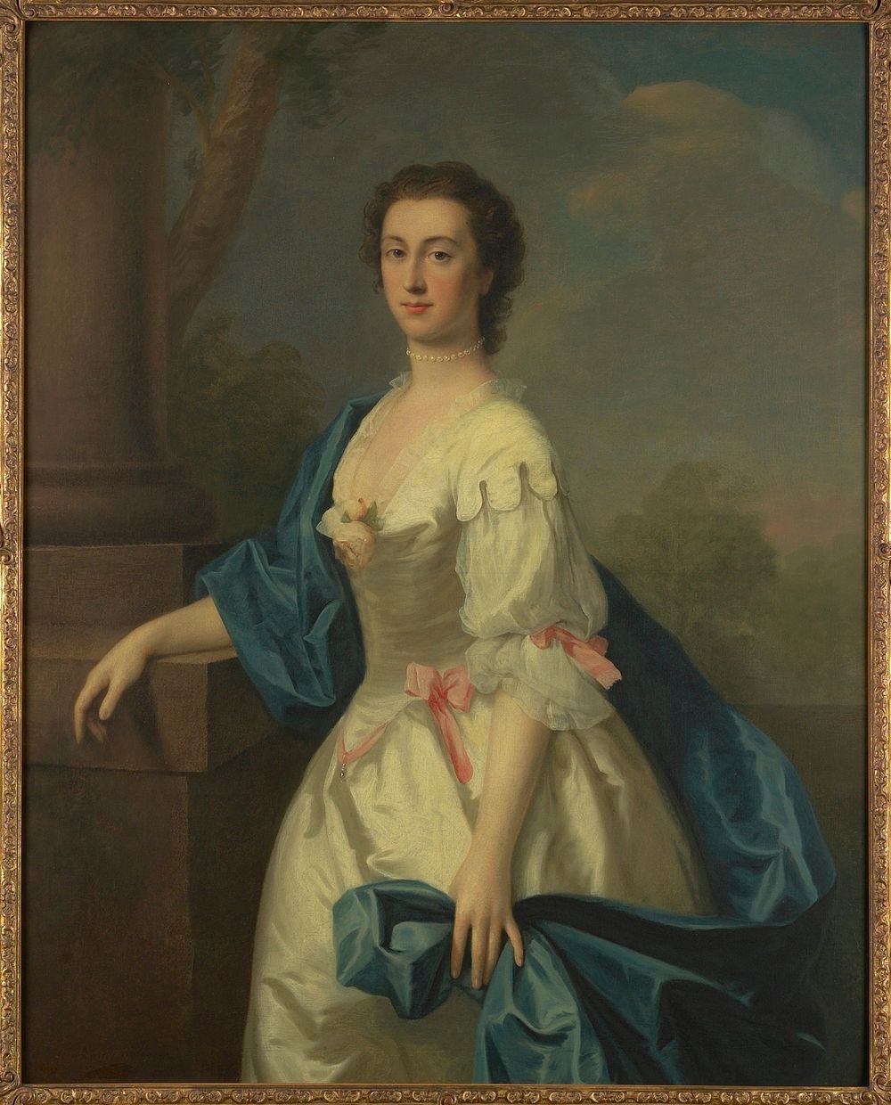 Three quarter length portrait of a lady in white dress with a blue satin scarf draped over right arm and shoulder, and…