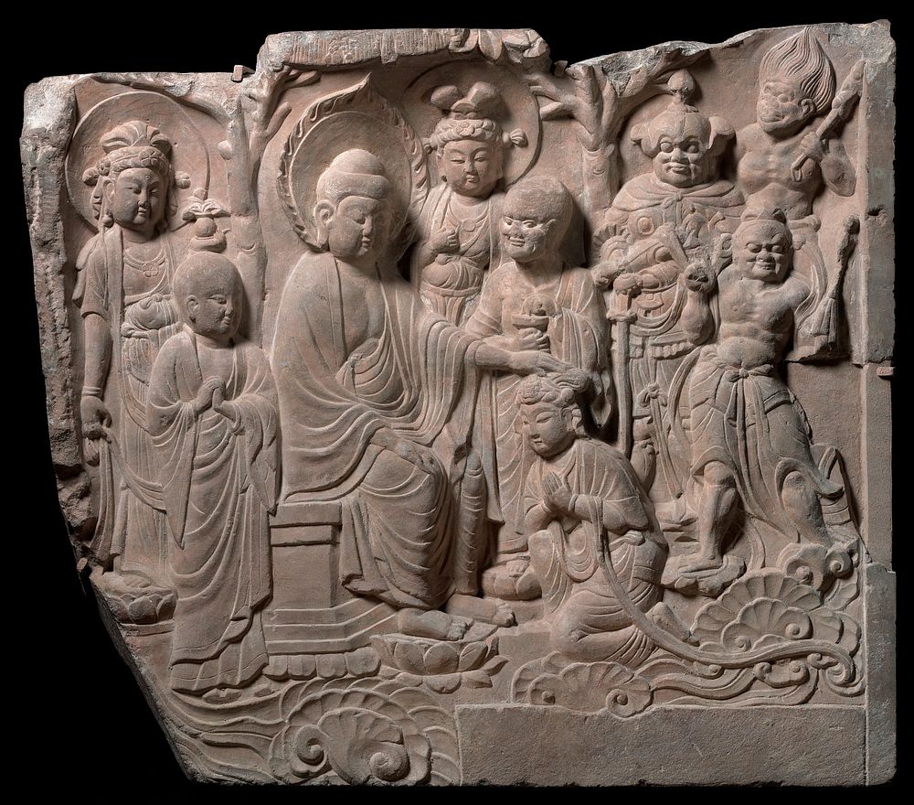 deep relief carving; Buddha at L seated on a throne with PL hand on head of kneeling Bodhisattva with clasped hands; 7 other…
